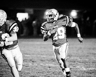 LaBrae's Cameron Truss (29) returns an interception for a TD against Girard during their game at LaBrae on Friday night.