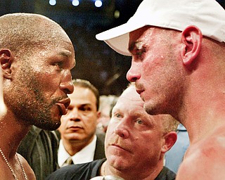 Bernard Hopkins and Kelly Pavlik at end of fight. Trainer Jack Loew in background.