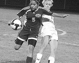 HOWLAND - FITCH -  (5) Sara Ford of Fitch gets tangled up with (1) Tyler Nicholas during their game Monday night in Howland. 