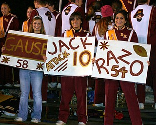 "Homecoming Queen Chelsie Leeson and fellow band members Kayla
Proverbs and Toni Geffert cheer on the Raider Football team Friday
night."