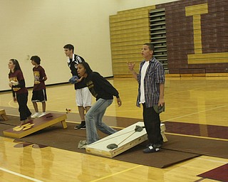 The Liberty Leopards enjoy themselves after the Hubbard game by competing in
a Corn Hole Tournament at the End Zone Party