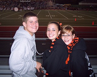 Stoney Brooks, Sarah Gabrick, and Devan Weckerly from Springfield enjoy the half time performances by the Springfield and East Palestine Marching Bands.
