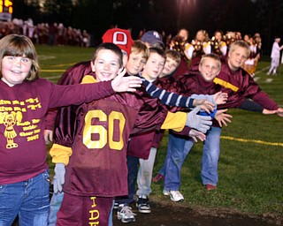 "South Range Elementary and Middle School fans wait for the team to
enter the stadium."
