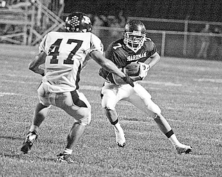 BOARDMAN-PERRY - (7) Ken Jones of Boardman makes a move on (47) Logan Wannar during their game Friday night in Boardman.