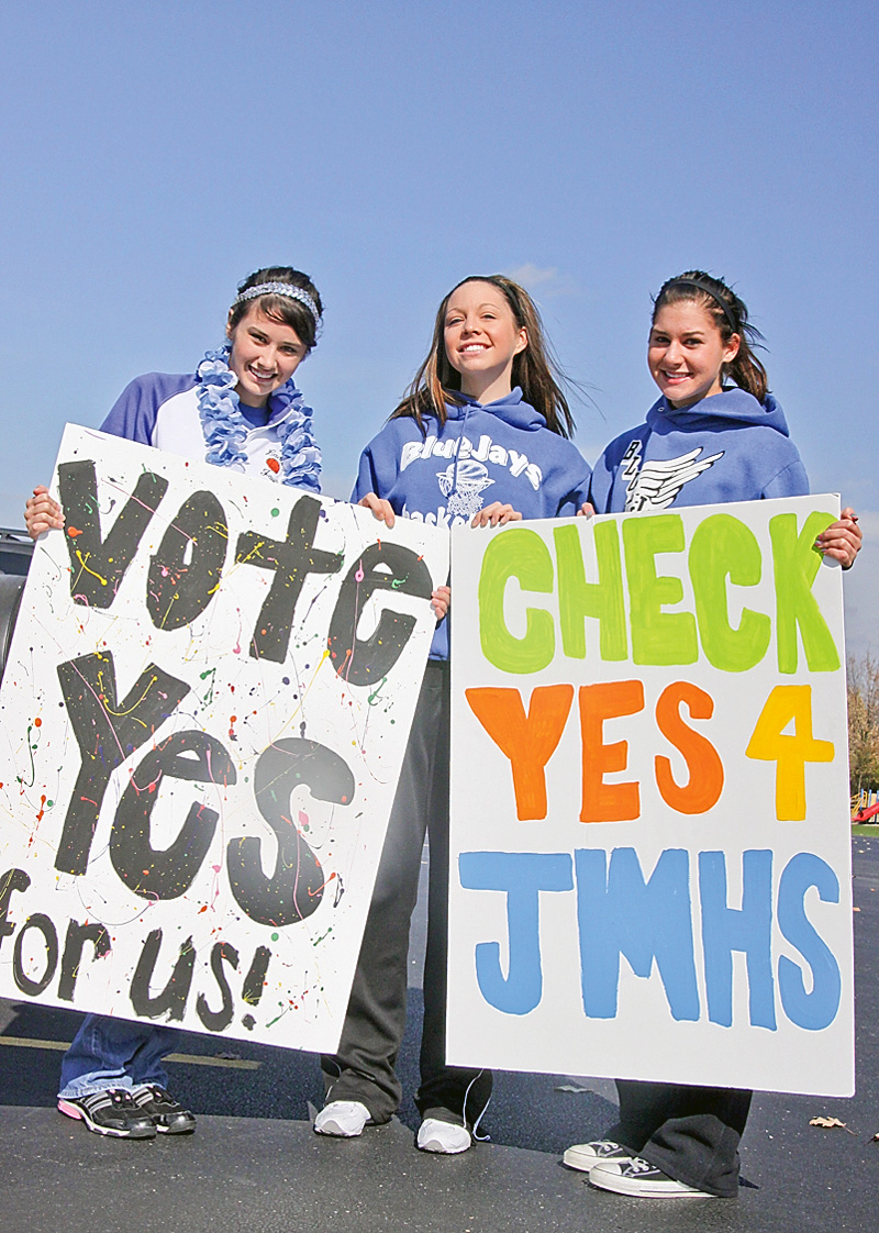 L-R Jessica Ripple (16) of Lake Milton, Brianna Vayner (16) of Lake Milton and Morgan Pinney (16) of North Jackson hold signs they made for the levy to be passed on Nov 4th. Sunday October 26, 2008