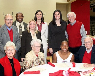 Some members of the Women's Basketball Staff (current and retired) pose with booster members.
