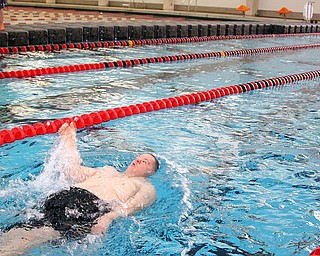Brian Carney, 40, swims in the 100M Backstroke from Trumbull Fairhaven in the 5th annual Special Olympics swim meet in memory of Kelly Jo Carlson.