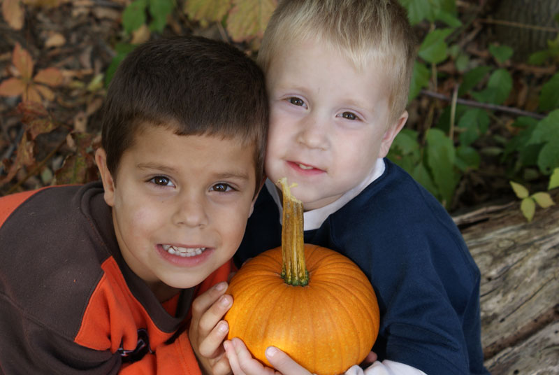 Sally Erb of Mineral Ridge photographed two of her three sons with their pumpkin. Evan, 6, and Ethan, 4, posed for mom after Evan came home from school, where they vissited Detwiler Farm in Columbiana.