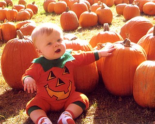 Johnathan Schiraldi enjoyed is first trip to the pumpkin patch. He even helped pick out his favorite. Mom Danielle and Dad John felt they had the cutest pumpkin, though.