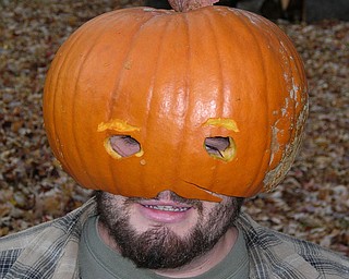 Mike Fox Jr. of Poland Township, aka "Mike-O-Lantern," has his carved-out pumpkin on his head.  His mom, Laurie Fox, submitted the photo.          