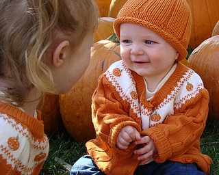 Sydney, 3, and Kennedy, 7 months, enjoy playing in the pumpkin patch at Whitehouse Farms.  Parents are Todd and Jacey Henderson of Poland.
 

                               