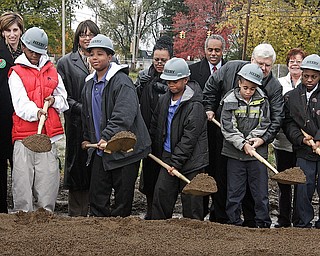 WILSON - Students from the Alpha and Athena schools break groung under the watchful eye of Dr. Wendy Webb and others Wednesday morning in Youngstown.