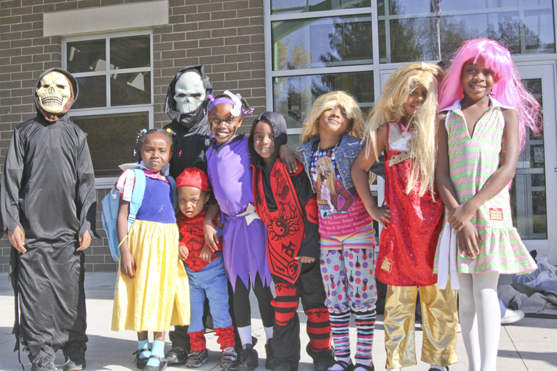 Students at Harding Elementary School on Youngstown's North Side, including these children of brothers Gary and Marvin Walker,  dressed in costume for Halloween Friday. Teachers joined in the fun and led the whole school on a parade up Fifth Avenue Friday afternoon. 