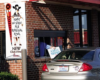 Recycling signs for food at Chick Fil A