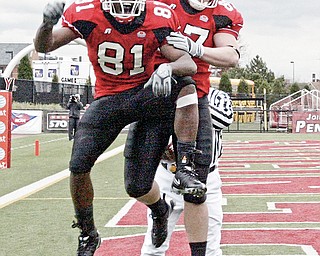 Donald Jones left and Derrick Bush react after Jones scored a TD for the Penguins Saturday.