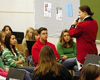 OLD GUARD: Rebecca Davidson plays the fife for band members at Boardman High School. She explained the difference between her fife flute and baroque flute, two of the instruments used in the Army Old Guard Fife & Drum Corps.