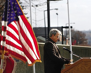 Jim Olive reads some of the 64 names of YSU students and faculty killed while on active military duty as part of a Veterans Day ceremony on campus.