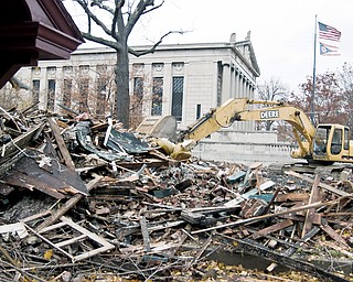 SITE IMPROVEMENT: Rubble is all that’s left of a house on Fifth Avenue at Park Street on Youngstown’s North Side. Seven dilapidated and boarded-up buildings are finally coming down. City officials refused to wait any longer for the buildings to be demolished; they had been vacant for two years.