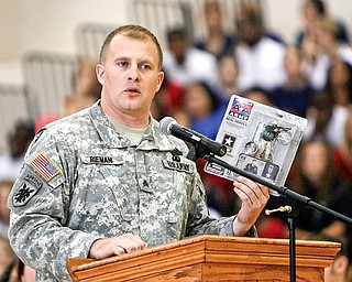 Tommy Rieman, who received a Purple Heart medal after getting shot up in Iraq. speaks to Liberty students at the Veterans Day Ceremony- he told about his experience in Iraq - and of being in a recruiting video as well as an Action figure