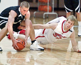 YSU's Tom Parks and Geneva's Richard Colick go for a loose ball.