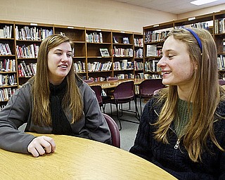 South Range Senior Hilary Skidmore, left, talks with frershan Melissa Melnick. They are involved in a program at the school called Sisterhood which pairs seniors with freshman.