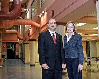 President of the Schools' Govening Authority Anthony D'Apolito and Judge Theresa Dellick of Juvenile Justice Center stand near the cafeteria at the new Mahoning County High School located at 3321 Hudson Ave in Youngstown.