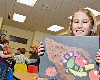 Angela Gaca, 6, of Austintown shows off her final product at the Butler Museum of American Art Children's Day. 