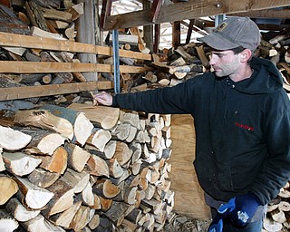 Jeremy Post of Gustavus Hardwoods shows firewood. 