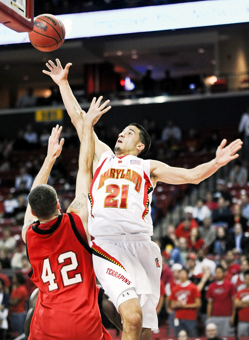 Maryland's Greivis Vasquez shoots against Youngstown State's Dallas Blocker in the first half of a NCAA college basketball game Tuesday, Nov. 18, 2008 in College Park, Md.