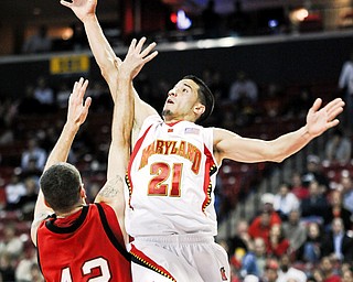 Maryland's Greivis Vasquez shoots against Youngstown State's Dallas Blocker in the first half of a NCAA college basketball game Tuesday, Nov. 18, 2008 in College Park, Md.