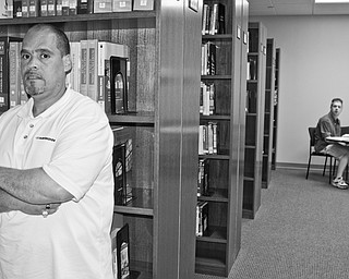 Danny Feliciano, a Hispanic male, poses in the library of National College on the North side of Youngstown where attends classes hoping to become an IT specialist. Danny was diagnosed HIV+ in 1993. Approaching his 16th medicated year, his advice to others with the disease is to "keep walking through life as though you don't have it."
"...People will always be looking over your shoulder...trying to get in your business and say something, you know me, you got to keep your chin up and take it one day at a time," he said.
For advice on coping with HIV, email him at felicianod25@natlcollege.edu.