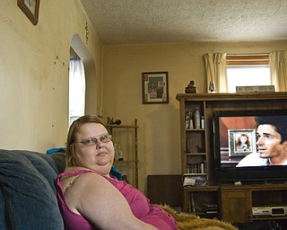 Olga Irwin, a straight, white female in Youngstown spent three years after her diagnosis in denial. Olga told people she had leukemia, lupus, hereditary blood disease and cancer -- anything to explain her doctor's visits and pill bottles. It's been years since she opened up about contracting HIV from a promiscuous boyfriend but much of her family still keeps their distance. Her sister will not let her swim in the pool with her niece and nephew, she said.
The fatigue and weight gain caused by HIV medications took a toll on Olga's self-esteem. She continues to experience waves of fear that she is prematurely dying. In response, she said she dyes her hair, flirts with younger men at bars, and overspends on concert tickets. Soap operas and a house full of animals help her combat those negative feelings, she said. Olga is currently pursuing a degree in social work from Youngstown State University.
"You feel like everyone can see it (HIV) inside of you. I want to help other people cope with that," she said.