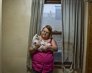 Olga Irwin, a straight, white female in Youngstown spent three years after her diagnosis in denial. Olga told people she had leukemia, lupus, hereditary blood disease and cancer -- anything to explain her doctor's visits and pill bottles. It's been years since she opened up about contracting HIV from a promiscuous boyfriend but much of her family still keeps their distance. Her sister will not let her swim in the pool with her niece and nephew, she said.
The fatigue and weight gain caused by HIV medications took a toll on Olga's self-esteem. She continues to experience waves of fear that she is prematurely dying. In response, she said she dyes her hair, flirts with younger men at bars, and overspends on concert tickets. Soap operas and a house full of animals help her combat those negative feelings, she said. Olga is currently pursuing a degree in social work from Youngstown State University.
"You feel like everyone can see it (HIV) inside of you. I want to help other people cope with that," she said.