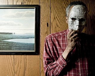 Wilbur, a straight, black male with HIV in Youngstown, reclines in his living room. His face is covered with a Halloween mask to hide his identity. Although he said he hasn't experienced much discrimination, he is careful about disclosing. "Years ago, a friend of our family had cancer. When we went over there, we were told to cover the toilet seat. That's how HIV is perceived now," he said.