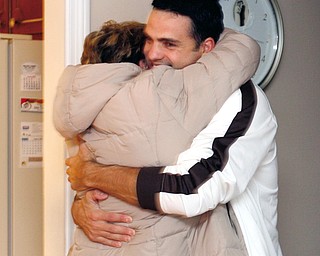 Chip Gilea hugs his neighbor - Melissa Ellis