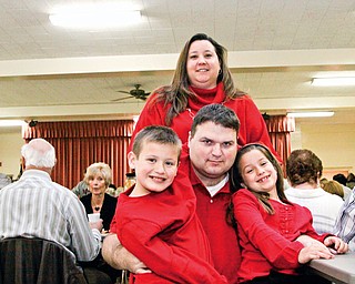 Heather Kutsch in back with her family, L-R Hunter (9), Mike and Maddison (7) at Girard First United Methodist Church for a spaghetti dinner benefit for Mike Kutsch who was diagnosed with Huntington's Disease 8 years ago Sunday.