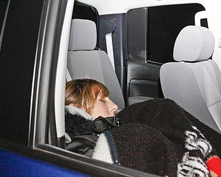 Jessica Sackin (20) of New Castle tries to get some sleep in the Best Buy parking lot located in Boardman, Thursday November 27, 2008