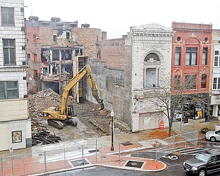 ON SCHEDULE: Demolition of the former State Theatre building continues in downtown Youngstown, making way for a center for high-tech ventures. The State Theatre was built in the fall of 1927 and was the fourth picture house to be at that location on West Feeral Street. It later served as the Agora rock nightclub.