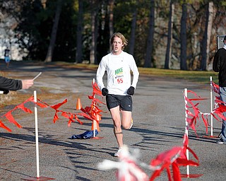 FINISH LINE: Scott Wolfe of East Palestine runs to victory at the first East Palestine Turkey Trot on Thanksgiving Day. Organizers hope to make the run an annual event.