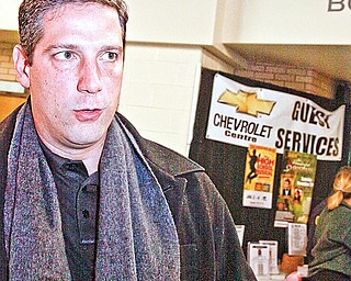 Congressman Tim Ryan speaks about the support for the auto industry during the rally at Chevy Centre Friday