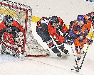 PHANTOMS - TRAVERSE CITY - (15) Jordy Trottier of the Phantoms battles (4) Bo Jacobs as (1) Brandon Stephenson keeps his eye on the puck during their game Friday night at the Chevrolet Centre.