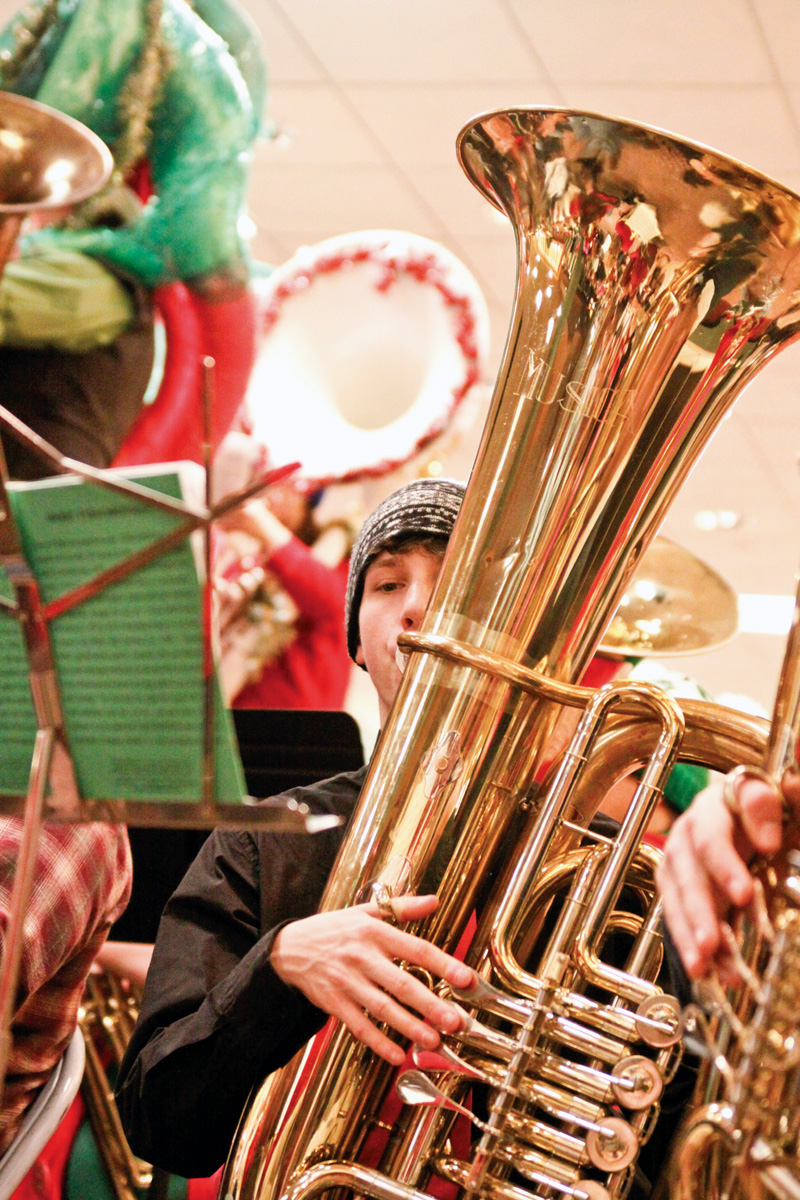 Hubbard Senior Jeff Yocum (17) plays a concert tuba for Tuba Christmas in the main concourse of Eastwood Mall in Niles.