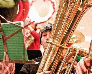 Hubbard Senior Jeff Yocum (17) plays a concert tuba for Tuba Christmas in the main concourse of Eastwood Mall in Niles.