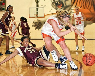 HOWLAND - LIBERTY - (2) Abby Nicholas of Howland gets tangled up with (34) Bianca Rozenblad of Liberty during their game Wednesday night.