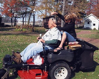 When Dan Burkey was too busy for a haircut, his stylist, Linda Moyer, decided to come to him. He was cutting grass at the Canfield Fairgrounds Western Reserve Village. Photo sent by Diane Playforth, a Western Reserve Village trustee.