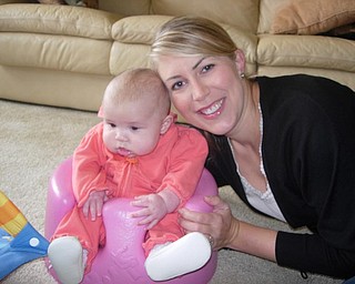 Emma, 4 months, was visiting her grandparents, Loren and Mag Mitchell, Uncle Jason and Aunt Kimberly with her parents, Gordon and Cara Petkosh in Canfield for Thanksgiving. Cara Petkosh, the Mitchells' daughter is pictured with her.