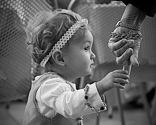 This shot is of Hannah (16 mos) holding the hand of her Grandma (Phyllis
LaPlante) at a birthday party last week. Hannah is "Nanni's" little girl,
right down to the love of jewelry! The picture was taken by Hannah's dad
(Phyllis's son) John.
Thanks for such a great feature!
Laurie LaPlante