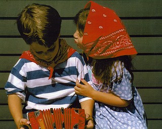 Patrick Krieger and Laine Vicarel, grandchildren of Michael J. Lacivita of Youngstown, act out a little scene for him.