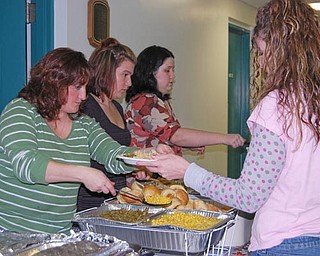 Kim Wess, Melissa Cook and Allison Rupp helped to serve meals. Meridian Services Project Safe facility on Chalmers Avenue, was filled to capacity as Meridian’s staff prepared and served Thanksgiving dinner to over 120 of its current residents and clients. This is the eleventh year that Meridian’s employees have provided the meal, each preparing a traditional Thanksgiving dish.
