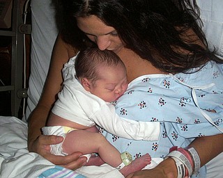 Danielle Trafficante with daughter Adriana Skye just shortly after she was
born. Picture taken by John Trafficante. All reside in Boardman